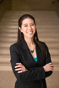 portrait of Mika Kennedy, a light-skinned woman with long brown hair, wearing a blazer